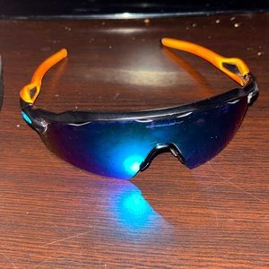 Blue and orange Oakley radar ev, minor scratches pretty good shape.